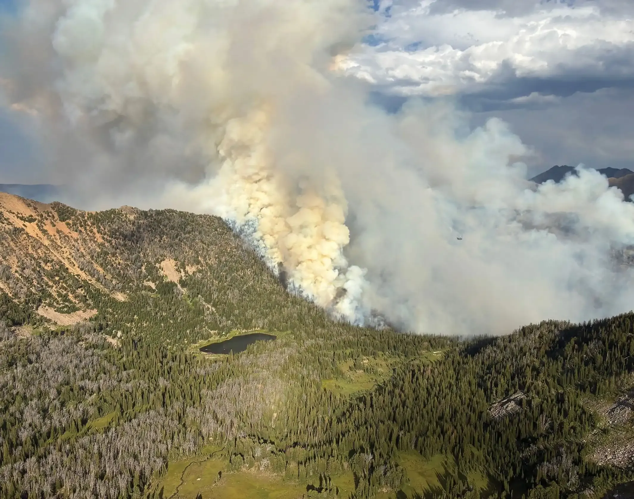 Men to Match Our Mountains: How Montana turns inmates into wildland firefighters 3 The Cloudrest Fire burning behind Rossiter Lake in the Tobacco Root Mountains