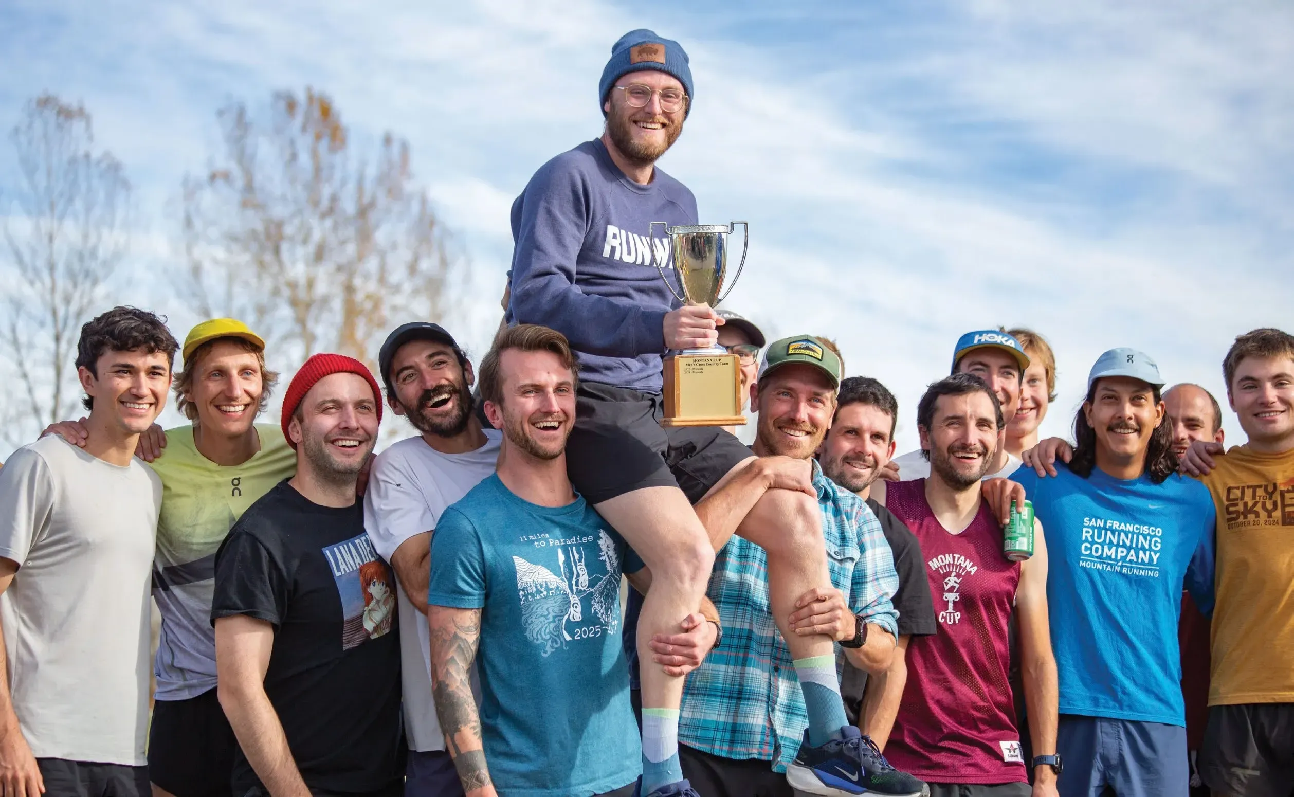 The Race of Every Runner's Dreams 6 The Missoula men’s team hoists captain Nico Composto, who holds the Montana Cup trophy