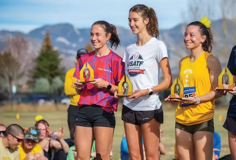 The Race of Every Runner's Dreams 5 Three women hold awards on the Montana Cup podium