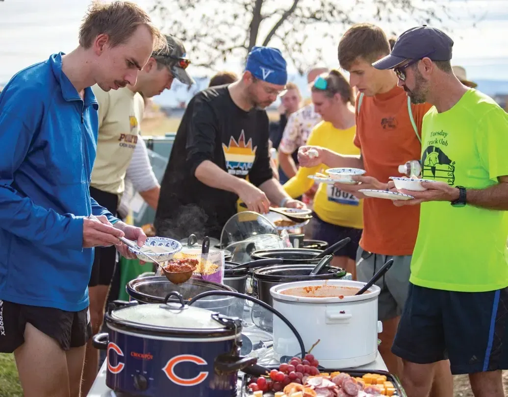 The Race of Every Runner's Dreams 9 Runners serve themselves from crock-pots at the post-race potluck